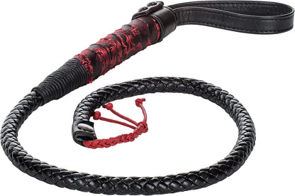 Leather bull whip with braided handle displayed fo
